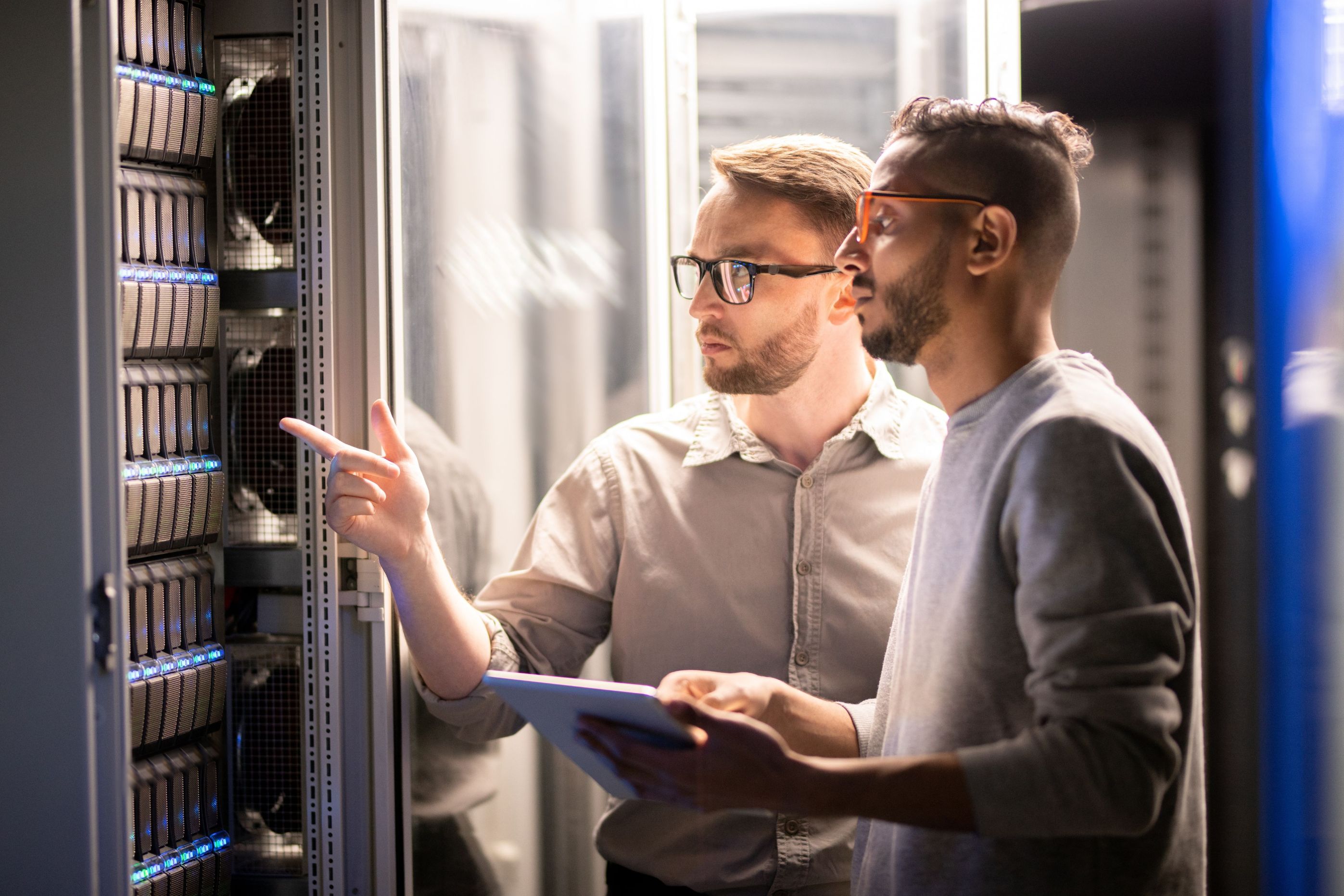 Two men looking at server